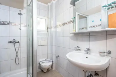 a bathroom with a sink and a toilet and a shower at Comfort Hotel Apartments in Rhodes Town
