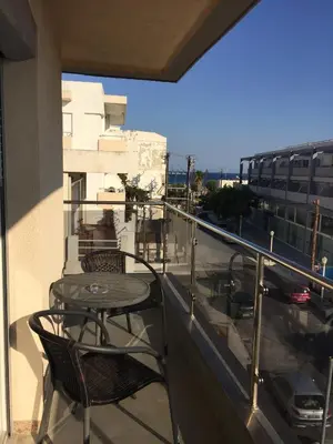 a patio with a table and chairs on a balcony at Comfort Hotel Apartments in Rhodes Town