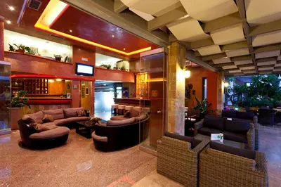 a bar with couches and chairs in a lobby at Comfort Hotel Apartments in Rhodes Town