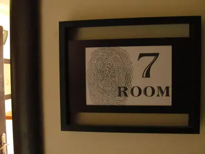 a framed picture of a room on a wall at Saint Amon Hotel in Faliraki