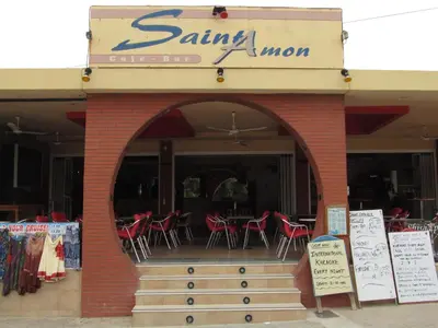 an entrance to a restaurant with chairs and tables at Saint Amon Hotel in Faliraki