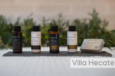a group of four products sitting on a shelf at Lindos Amphitheater Villas and Apartments in Líndos