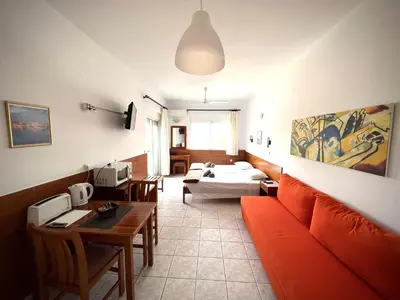 a living room with a couch and a table at SCALA APARTS & STUDIOS - Rhodes in Afantou