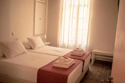 a hotel room with two towels on a bed at Kleanthe in Halki