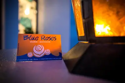 a box of blue roros sitting on a table at Blue Roses in Ixia