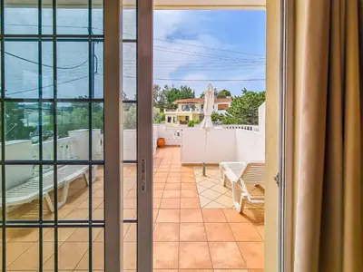 a view from the balcony of a house with a patio at Colonial Studio/Apartment in Faliraki