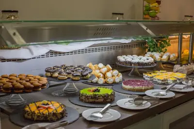 a bunch of different types of cakes and pastries at Akti Imperial Deluxe Resort & Spa Dolce by Wyndham in Ixia