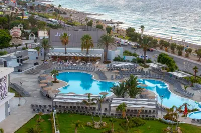 an aerial view of a resort with a pool and the ocean at Akti Imperial Deluxe Resort & Spa Dolce by Wyndham in Ixia