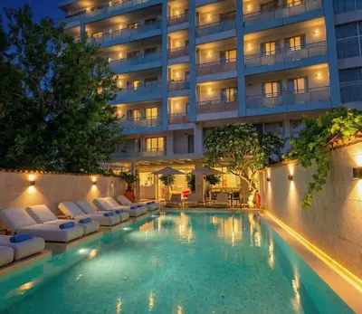 a swimming pool in front of a building at AQUAMARE CITY and BEACH in Rhodes Town