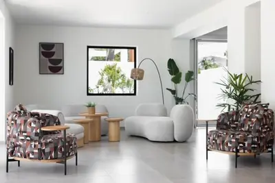 a living room with two chairs and a couch at Aiora Aqua Resort in Pefki Rhodes