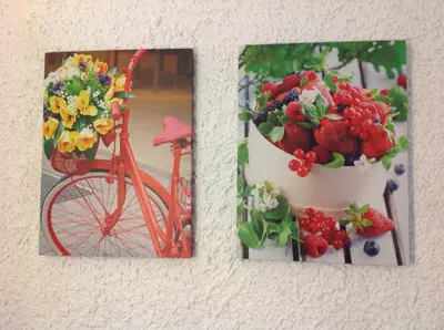 two pictures of flowers and a bike with a basket of strawberries at Aialion studios & apartments - Steve Apartments in Rhodes Town
