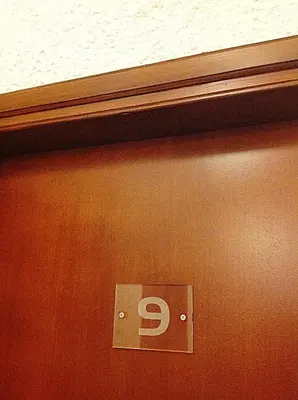 a metal sign on a door with the letter p on it at Aialion studios & apartments - Steve Apartments in Rhodes Town