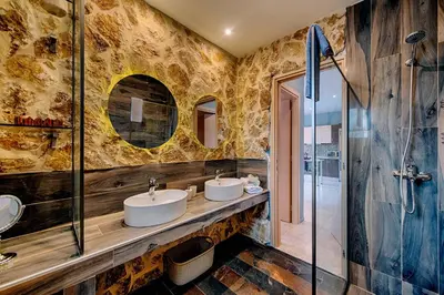 a bathroom with two sinks and a shower at Afandou Beach Villas Sofias in Afantou