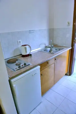 a kitchen with a sink and a counter top at Maroula Studios in Faliraki