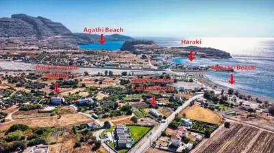 an aerial view of a beach and the ocean at Paul's Garden Studios in Haraki