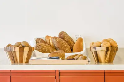 a tray of breads and pastries on a counter at Esperia City Hotel in Rhodes Town