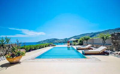 a villa with a swimming pool and a view of the ocean at Villa Lindos Kalliopi on Rhodes AMA 0 0 0 0 3 6 6 0 4 0 3 in Líndos