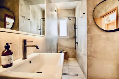 a bathroom with a sink and a mirror at Villa Lindos Kalliopi on Rhodes AMA 0 0 0 0 3 6 6 0 4 0 3 in Líndos