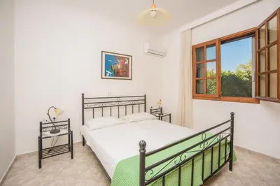 a bedroom with a bed and a window at Lila's house in Eleoúsa