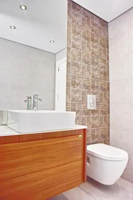 a bathroom with a tub and a toilet and a sink at Alkyoni City Apartment in Rhodes Town