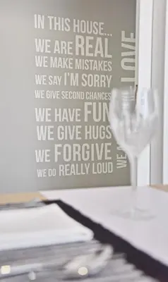 a table with a glass of wine on it at Alkyoni City Apartment in Rhodes Town