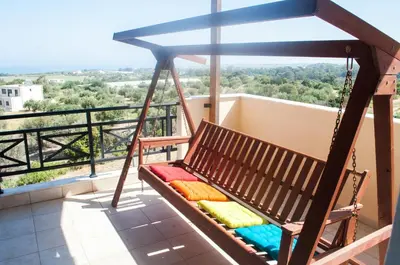 a swing on the balcony of a house at Stan&Family in Kalavárda