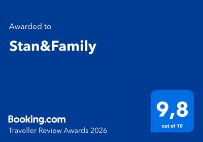 a blue sign with the words stranger review awards at Stan&Family in Kalavárda