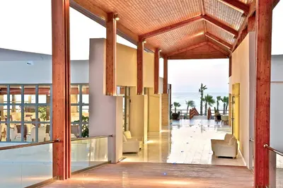 a lobby of a resort with a view of the ocean at All Senses Nautica Blue Exclusive Resort & Spa - All Inclusive in Phanaes