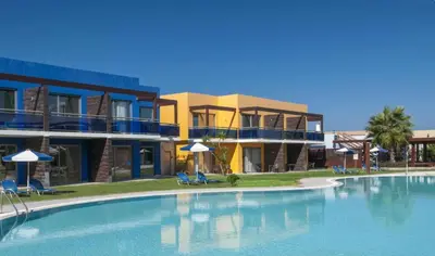 a large swimming pool in front of some buildings at All Senses Nautica Blue Exclusive Resort & Spa - All Inclusive in Phanaes
