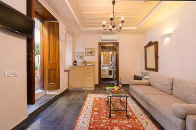 a living room with a couch and a table at Rodos Niohori Elite Suites Boutique Hotel in Rhodes Town