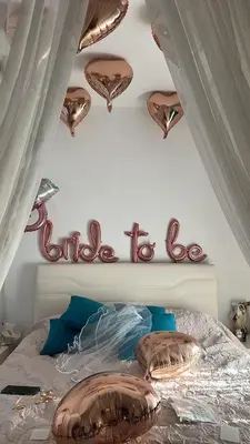 a bed with a baseball sign on the wall at Villa Rose on the beach in Afantou