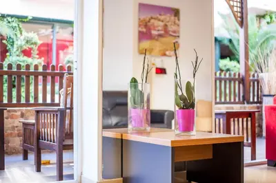 a table with two vases with plants on it at Filmar Hotel, Ixia, Rhodes in Ixia