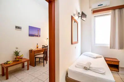 a room with a bed and a desk with a desk at Filmar Hotel, Ixia, Rhodes in Ixia
