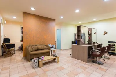 a living room with a couch and a desk at Ekaterini Hotel in Kiotari