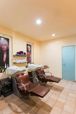 a bathroom with three sinks in a room at Ekaterini Hotel in Kiotari