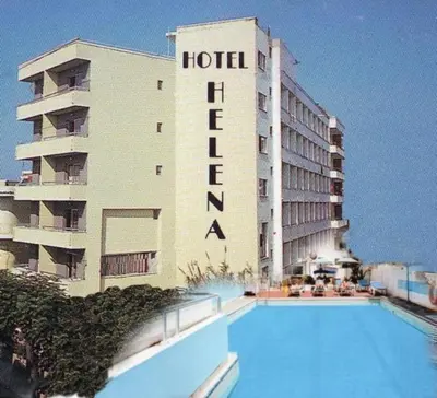 a hotel with a swimming pool in front of a building at Helena Hotel in Rhodes Town