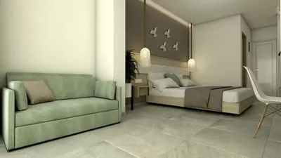 a bedroom with a bed and a couch and a chair at Artemis Comfort&Pleasure in Faliraki