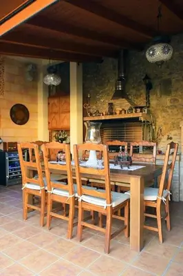 a dining room with a table and four chairs at Paris Hotel in Rhodes Town