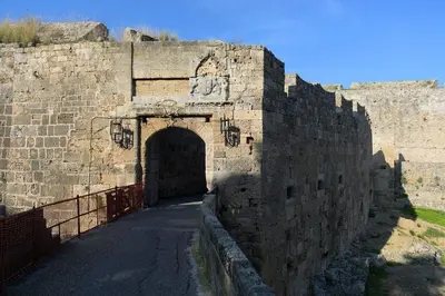 a large brick wall with a tunnel in it at Paris Hotel in Rhodes Town