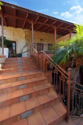 a set of stairs leading to a building with a roof at Paris Hotel in Rhodes Town