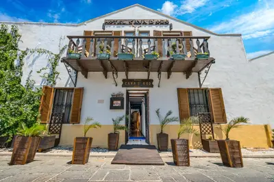 a building with a balcony on top of it at Cava d'Oro in Rhodes Town