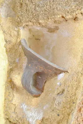 an old metalfork sticking out of the ground at Cava d'Oro in Rhodes Town