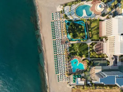 an aerial view of a resort next to the water at Esperos Palace Resort & Spa in Faliraki