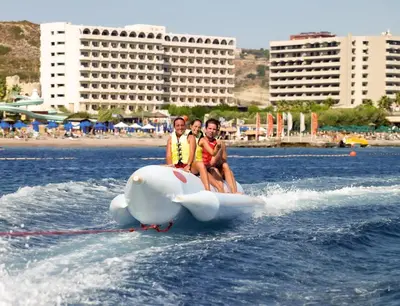 two people are riding on at Esperos Palace Resort & Spa in Faliraki