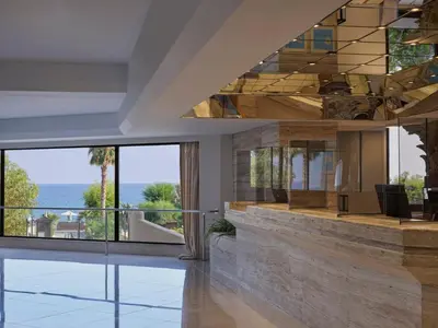 a lobby with a view of the ocean at Esperos Palace Resort & Spa in Faliraki