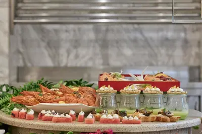 a buffet of food on top of a table at Esperos Palace Resort & Spa in Faliraki