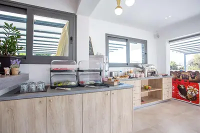a kitchen with a counter with some food on it at Madison Boutique, Faliraki in Faliraki