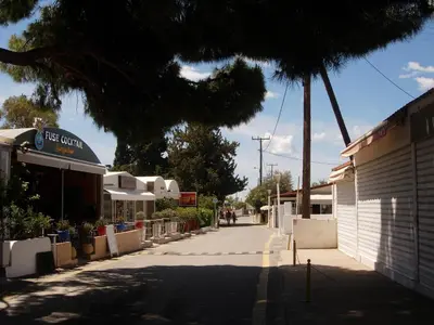 an empty street in a town with a building at Maria Apartments in Pefki Rhodes