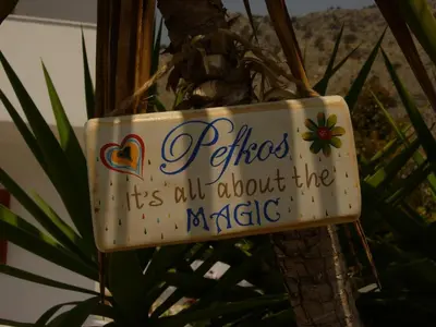 a sign that says fishes its out about the magic at Maria Apartments in Pefki Rhodes