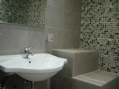 a bathroom with a sink and a bath tub at Maria Apartments in Pefki Rhodes